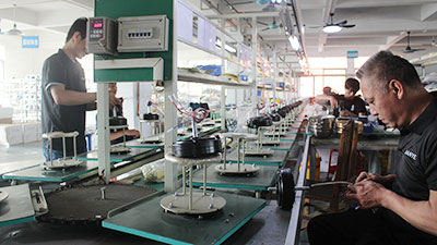High-Efficiency Assembly Line Production Semi-automated assembly line production at our decorative ceiling fan factory.