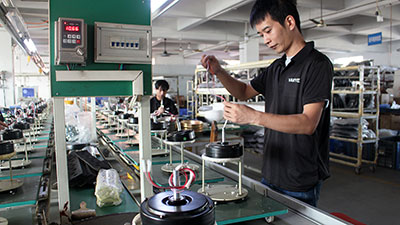 Precision component assembly line for smart DC motor ceiling fans.