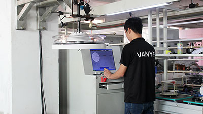 Dynamic balance testing of ceiling fan motor and blades in the factory.
