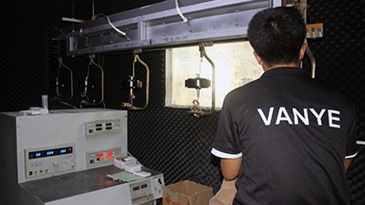 Advanced Noise & Decibel Testing for Quiet Operation Technicians performing noise and decibel testing for whisper-quiet DC motor ceiling fans.