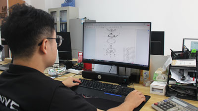 VANYE R&D engineer designing high-performance ceiling fan Motor on CAD software.